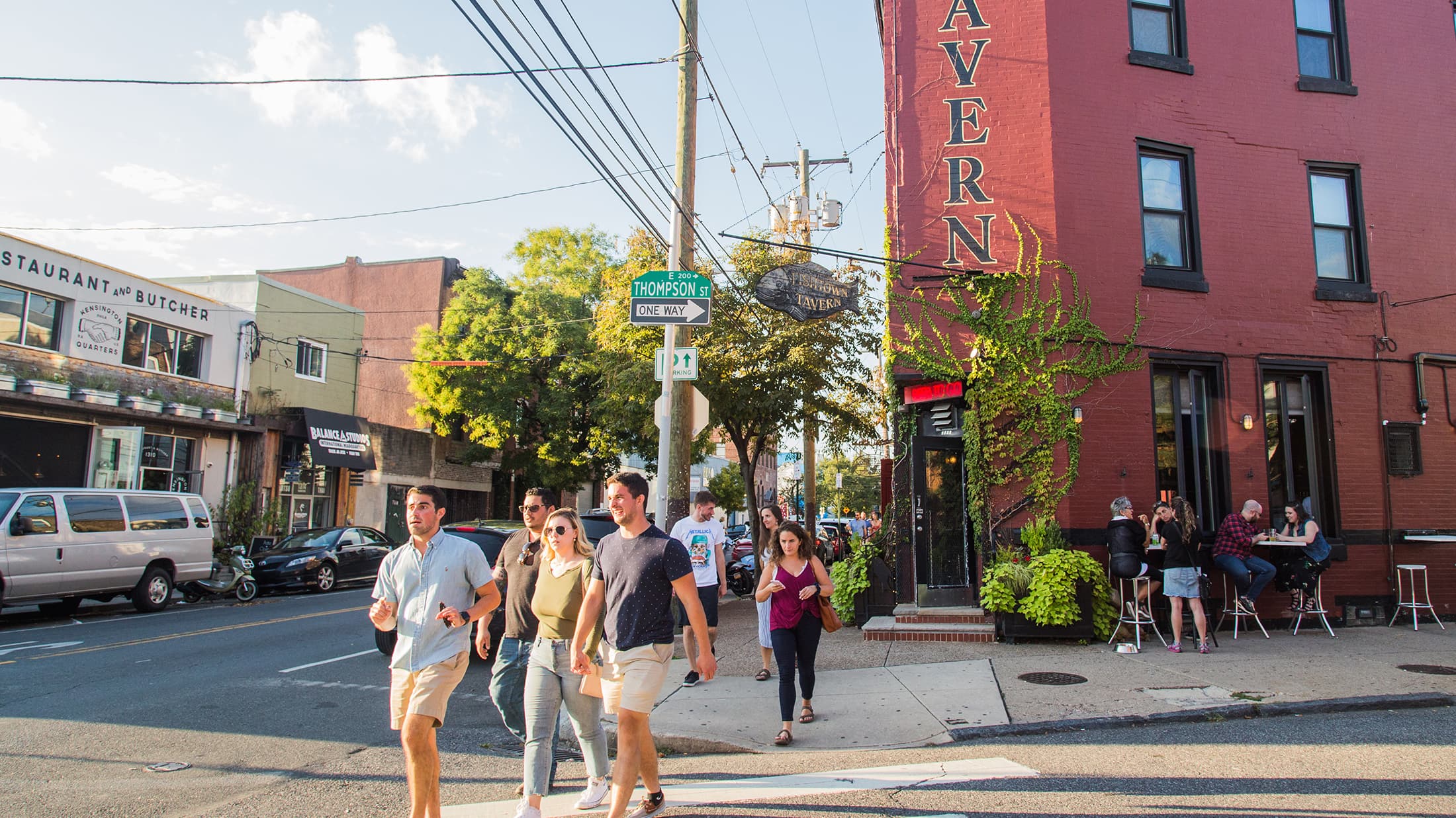 Fishtown Philadelphia street scene with restaurants and people walking near Hancock Lofts